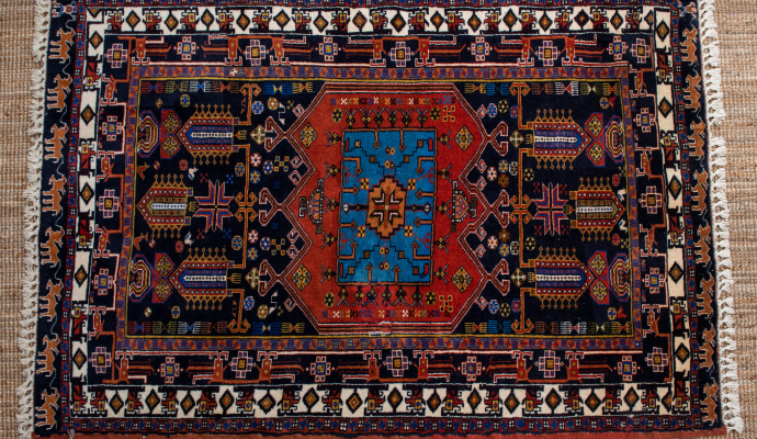 a detailed silk rug with a complex design