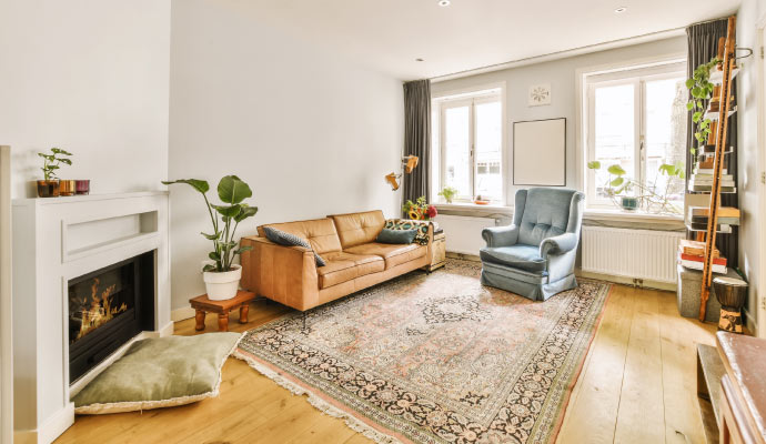 A large and clean patterned rug in a living room