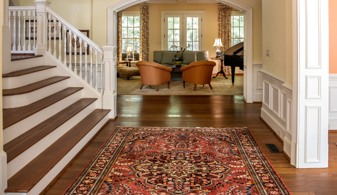 an interior view of a house with red rug